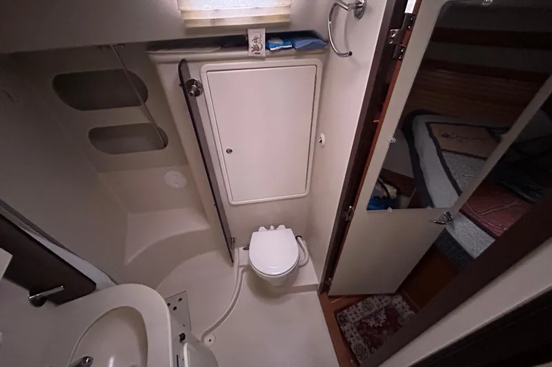  Yacht Photos Pics Bathroom interior of a 2009 Catalina 375 sailboat, featuring a compact toilet and sink.