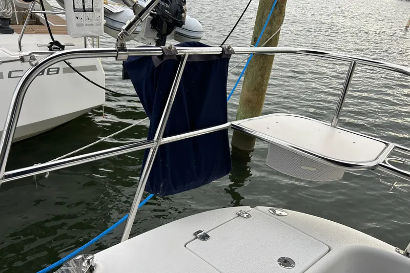  Yacht Photos Pics Catalina 375 sailboat stern view with railing and water backdrop, 2009 model.