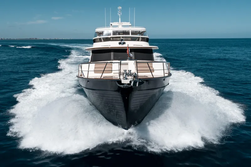 Rat Pack Yacht Photos Pics 2011 Marlow Explorer yacht cruising on open sea under clear blue sky.