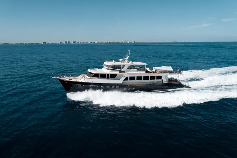 Rat Pack Yacht Photos Pics Luxury 2011 Marlow Explorer yacht cruising on open sea under clear blue sky.