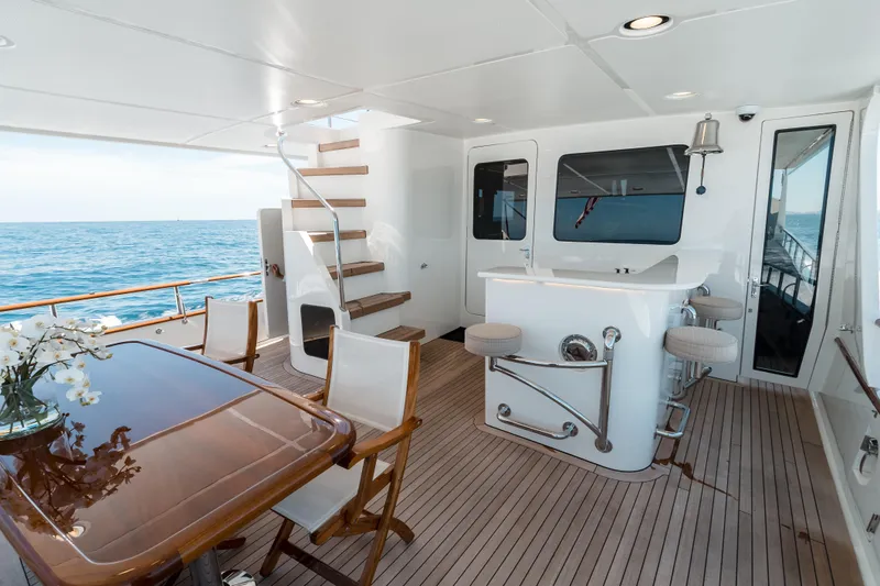 Rat Pack Yacht Photos Pics Luxurious 2011 Marlow Explorer yacht deck with bar, dining area, and ocean view.