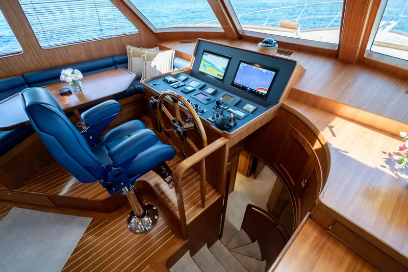 Rat Pack Yacht Photos Pics Luxurious 2011 Marlow Explorer yacht helm with blue captain's chair and advanced navigation systems.