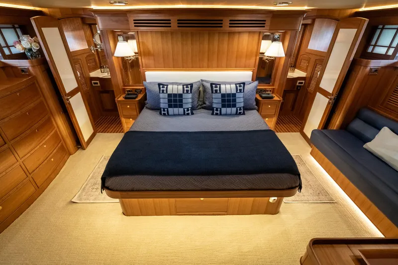 Rat Pack Yacht Photos Pics Luxurious 2011 Marlow Explorer yacht bedroom with elegant wood finish and cozy bedding.