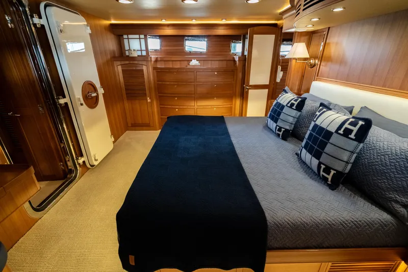 Rat Pack Yacht Photos Pics Luxurious 2011 Marlow Explorer yacht bedroom with elegant wood finish and cozy bedding.