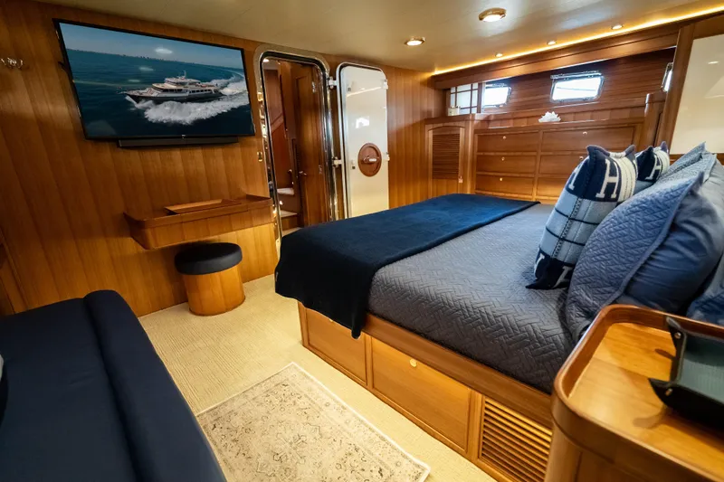 Rat Pack Yacht Photos Pics Luxurious 2011 Marlow Explorer yacht bedroom with elegant wood paneling and modern amenities.
