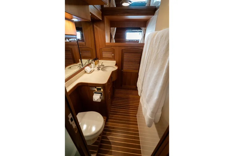 Rat Pack Yacht Photos Pics Luxurious 2011 Marlow Explorer yacht bathroom with wooden accents and modern fixtures.