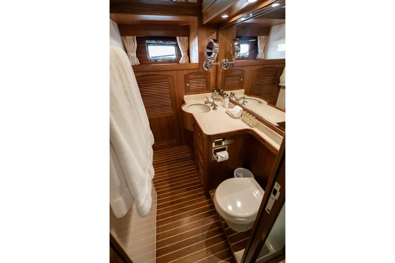 Rat Pack Yacht Photos Pics Luxurious 2011 Marlow Explorer yacht bathroom with wood accents and modern fixtures.