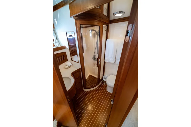 Rat Pack Yacht Photos Pics Luxurious 2011 Marlow Explorer yacht bathroom with wood accents and modern amenities.