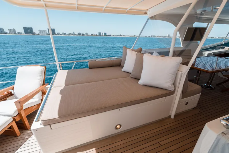 Rat Pack Yacht Photos Pics Luxurious 2011 Marlow Explorer yacht deck with sunbed and ocean view.