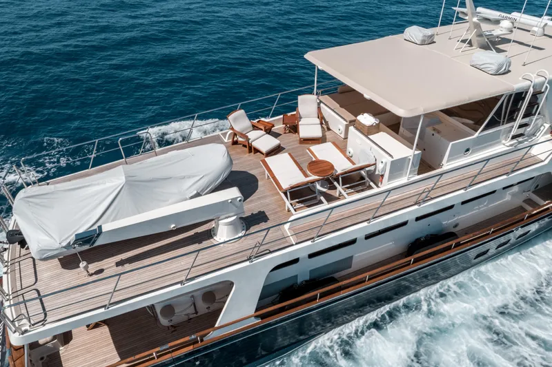 Rat Pack Yacht Photos Pics Luxurious 2011 Marlow Explorer yacht cruising on open sea, featuring spacious deck and seating area.