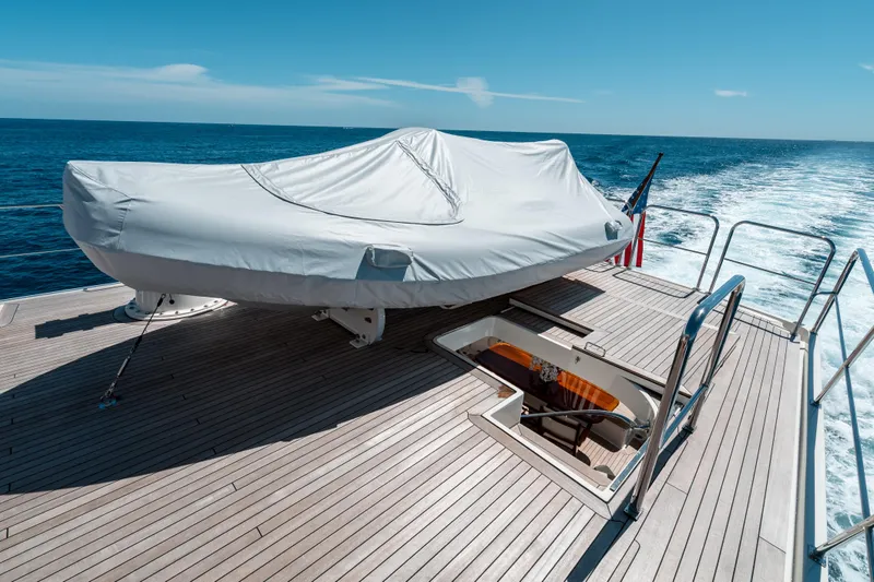 Rat Pack Yacht Photos Pics 2011 Marlow Explorer yacht deck with covered equipment, ocean view, and American flag.