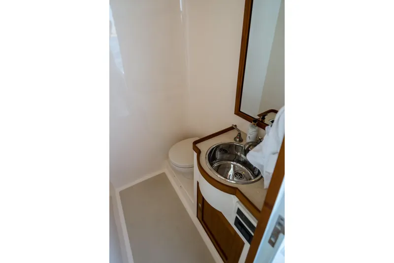 Rat Pack Yacht Photos Pics Bathroom interior of 2011 Marlow Explorer yacht with sink and toilet.
