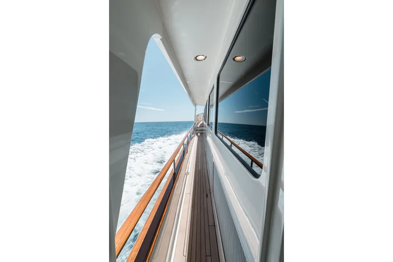 Rat Pack Yacht Photos Pics Side view of 2011 Marlow Explorer yacht cruising on open sea.