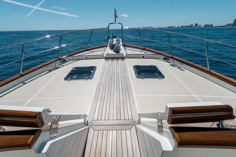 Rat Pack Yacht Photos Pics Bow view of 2011 Marlow Explorer yacht cruising on open sea under clear skies.