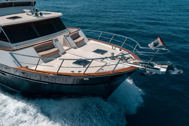 Rat Pack Yacht Photos Pics Luxurious 2011 Marlow Explorer yacht cruising on open sea, showcasing sleek design and elegance.