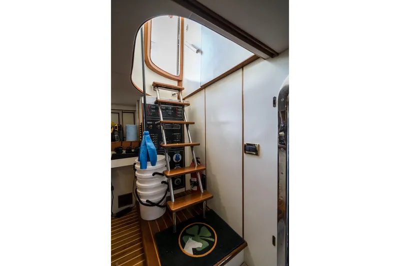 Rat Pack Yacht Photos Pics Interior of 2011 Marlow Explorer yacht with wooden stairs and storage area.