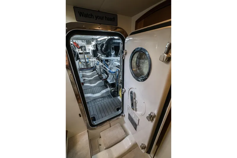 Rat Pack Yacht Photos Pics Engine room of 2011 Marlow Explorer yacht, featuring open door and visible machinery.