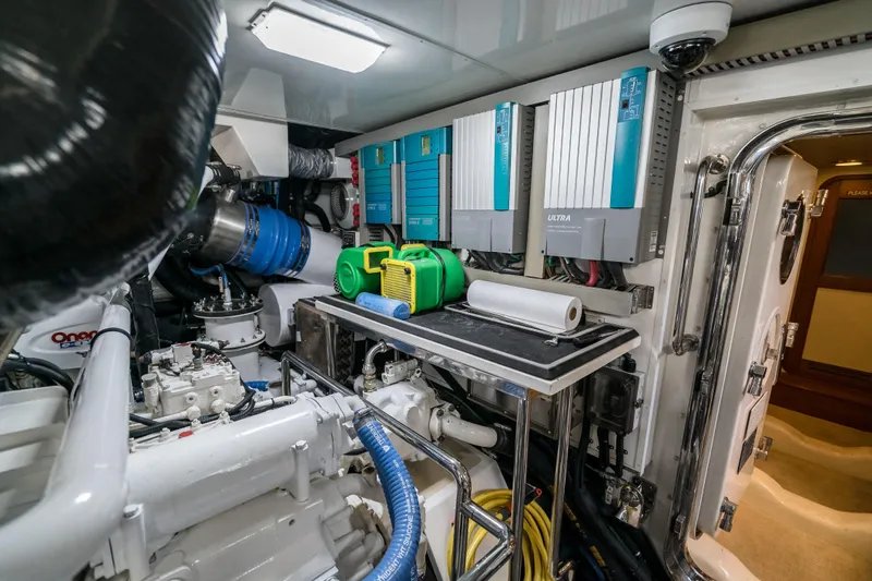 Rat Pack Yacht Photos Pics Engine room of 2011 Marlow Explorer yacht with equipment and control panels.