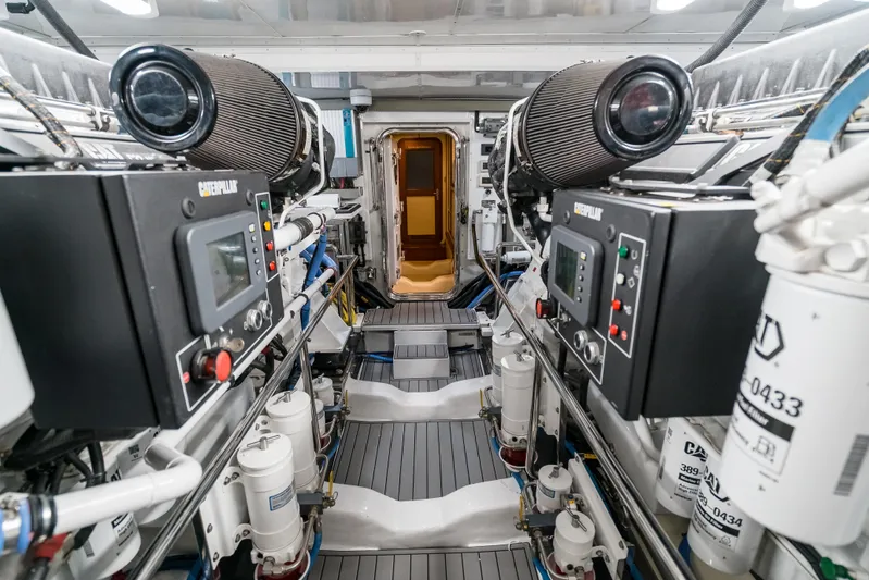Rat Pack Yacht Photos Pics Engine room of 2011 Marlow Explorer yacht with Caterpillar machinery and advanced controls.