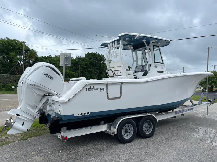  Yacht Photos Pics 2026 Tidewater 282 CC Adventure boat on trailer, featuring Yamaha outboard motor.