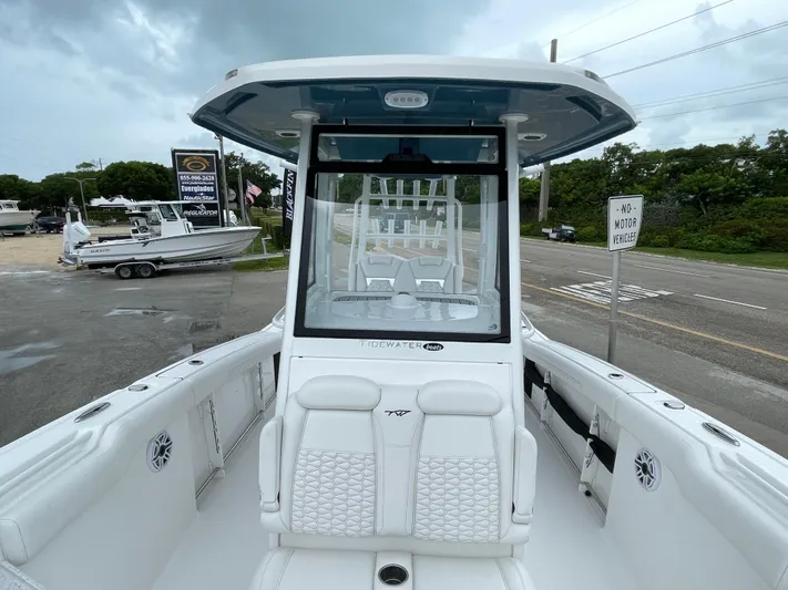  Yacht Photos Pics 2026 Tidewater 282 CC Adventure boat with sleek white interior and modern design.