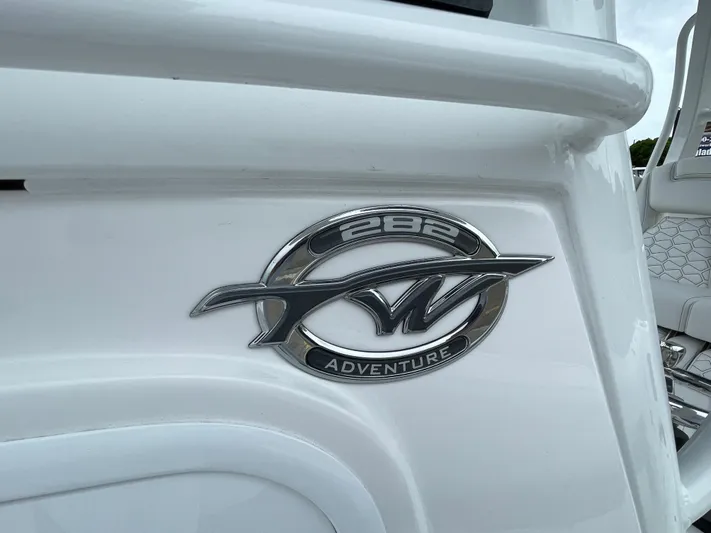  Yacht Photos Pics 2026 Tidewater 282 CC Adventure boat emblem on white surface.