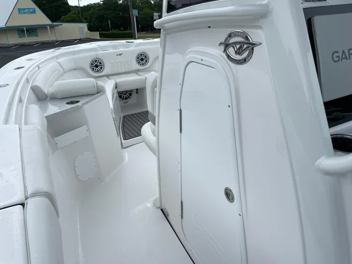 Yacht Photos Pics 2026 Tidewater 282 CC Adventure boat interior with seating and storage compartments.