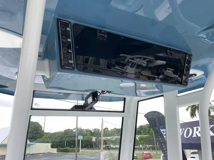  Yacht Photos Pics 2026 Tidewater 282 CC Adventure boat console with control panel and overhead electronics.