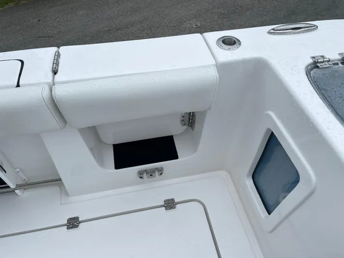  Yacht Photos Pics 2026 Tidewater 282 CC Adventure boat interior with storage compartments and seating.