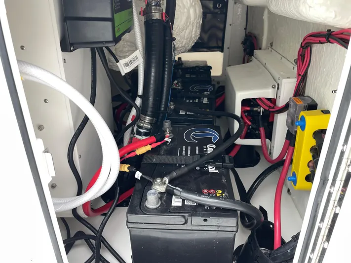  Yacht Photos Pics Battery compartment of 2026 Tidewater 282 CC Adventure boat, showcasing wiring and components.