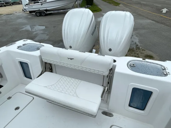  Yacht Photos Pics 2026 Tidewater 282 CC Adventure boat with dual Yamaha engines and white seating.