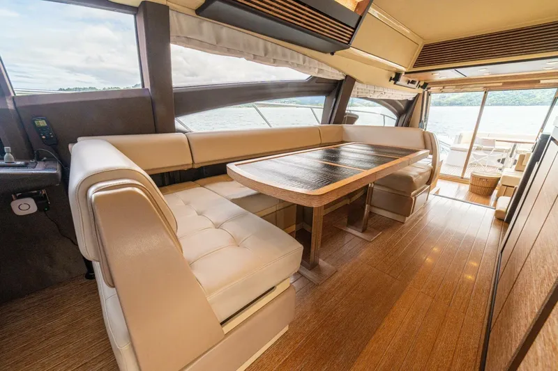 Costa Luna Yacht Photos Pics Luxurious interior of a 2014 Azimut 64 yacht with elegant seating and wooden flooring.
