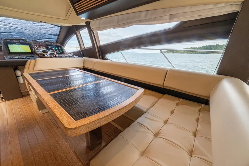 Costa Luna Yacht Photos Pics Luxurious interior of 2014 Azimut 64 yacht with elegant seating and navigation controls.