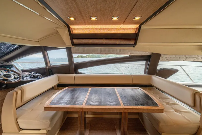 Costa Luna Yacht Photos Pics Luxurious interior of 2014 Azimut 64 yacht with elegant seating and panoramic windows.