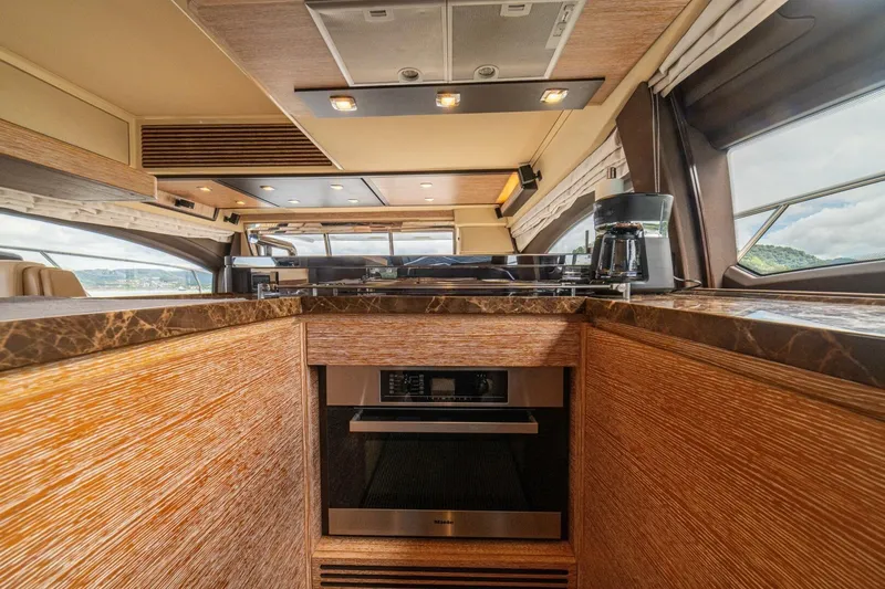 Costa Luna Yacht Photos Pics Luxurious interior of 2014 Azimut 64 yacht with modern kitchen amenities.