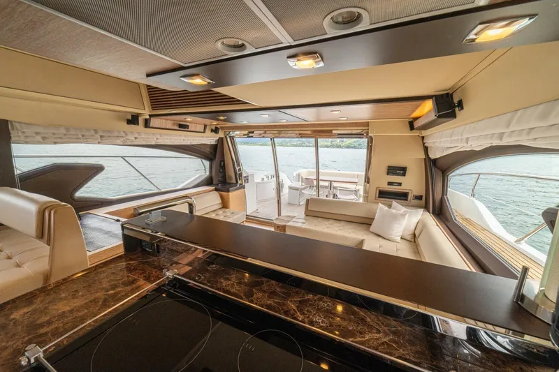 Costa Luna Yacht Photos Pics Luxurious interior of 2014 Azimut 64 yacht with elegant seating and panoramic windows.