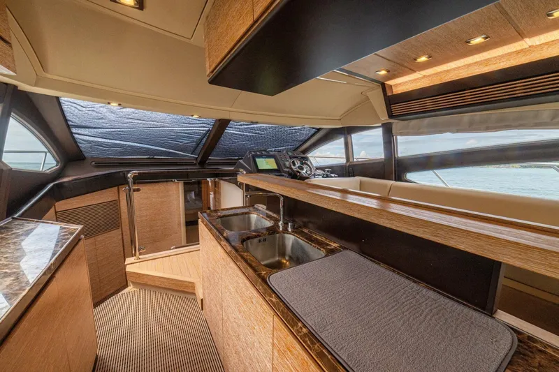 Costa Luna Yacht Photos Pics Luxurious interior of 2014 Azimut 64 yacht with modern kitchen and helm.