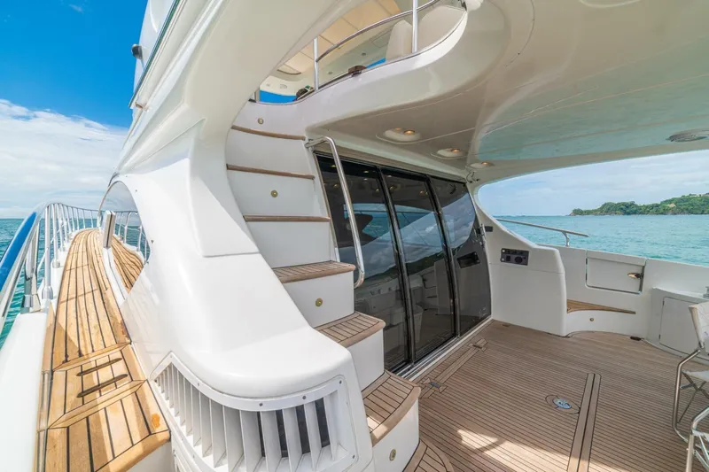 Costa Luna Yacht Photos Pics Luxurious 2014 Azimut 64 yacht deck with elegant wood finish and ocean view.