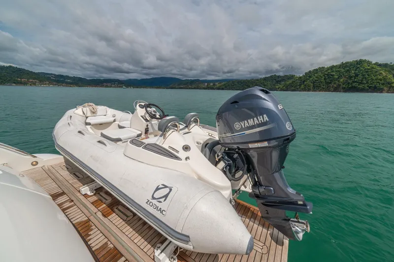 Costa Luna Yacht Photos Pics ```json { "alt_text": "2014 Azimut 64 yacht with Zodiac tender and Yamaha engine on water." } ```