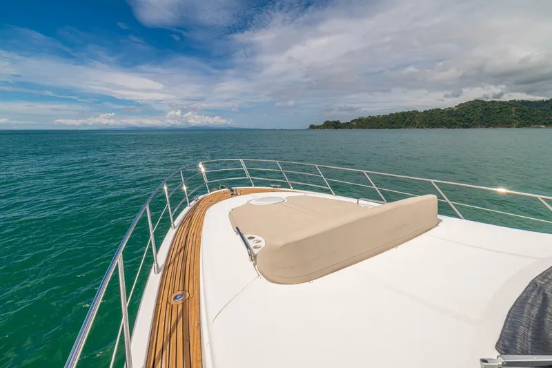 Costa Luna Yacht Photos Pics Azimut 64 yacht cruising on open sea, 2014 model, with scenic ocean view.