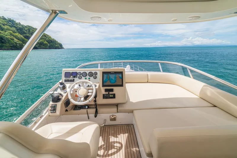 Costa Luna Yacht Photos Pics Luxurious 2014 Azimut 64 yacht helm with ocean view and modern navigation controls.