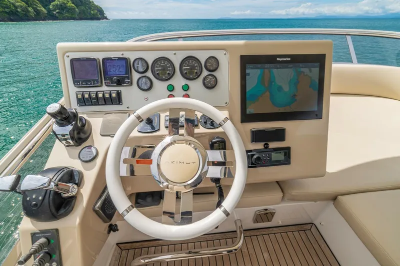 Costa Luna Yacht Photos Pics 2014 Azimut 64 yacht helm with navigation controls and ocean view.