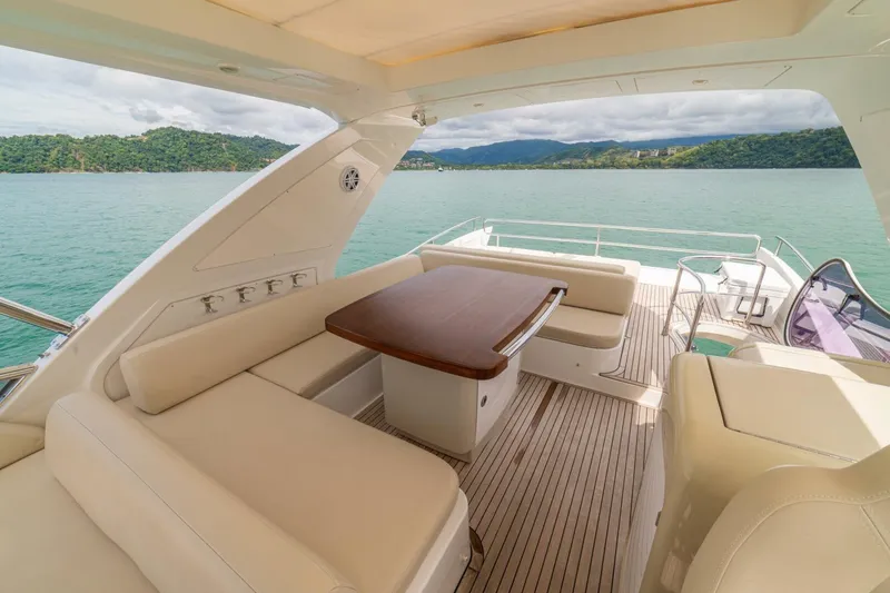 Costa Luna Yacht Photos Pics Luxurious 2014 Azimut 64 yacht deck with elegant seating and scenic ocean view.