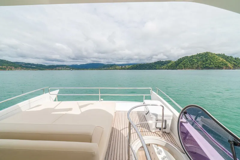 Costa Luna Yacht Photos Pics Luxurious 2014 Azimut 64 yacht deck with scenic ocean and island view.