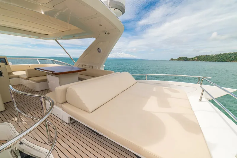 Costa Luna Yacht Photos Pics Luxurious 2014 Azimut 64 yacht deck with seating, ocean view, and clear skies.