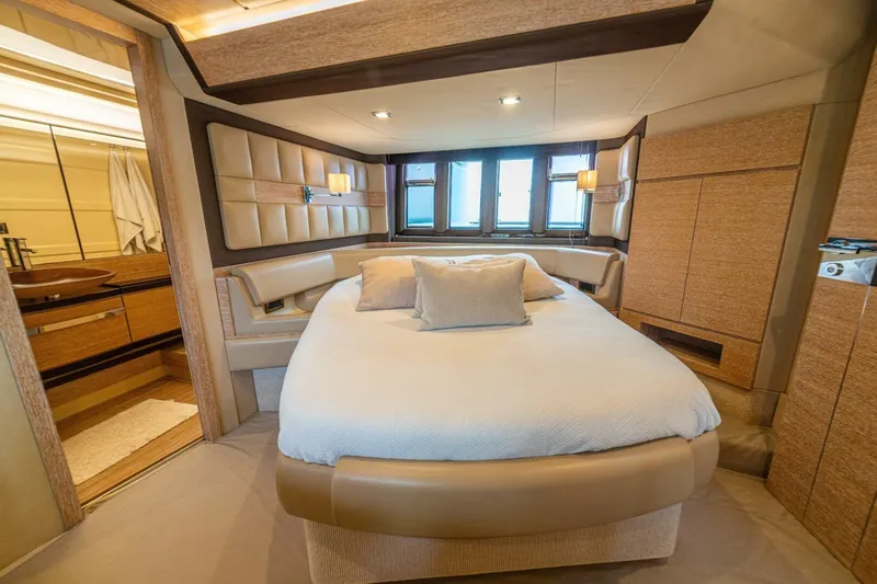 Costa Luna Yacht Photos Pics Luxurious bedroom interior of 2014 Azimut 64 yacht with elegant design and cozy ambiance.