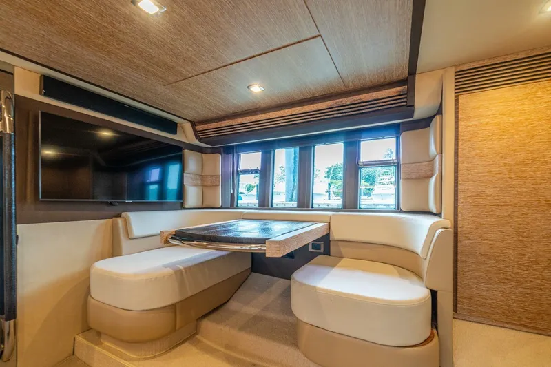 Costa Luna Yacht Photos Pics Luxurious interior of 2014 Azimut 64 yacht with elegant seating and large windows.