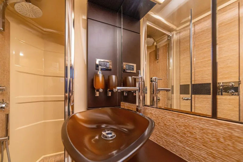 Costa Luna Yacht Photos Pics Luxurious bathroom in 2014 Azimut 64 yacht with modern fixtures and elegant design.