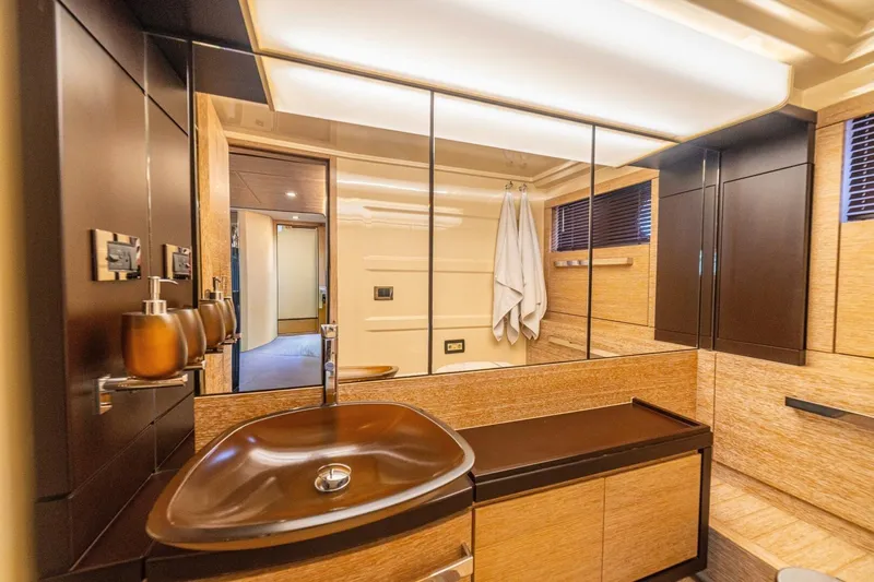 Costa Luna Yacht Photos Pics Luxurious bathroom interior of 2014 Azimut 64 yacht with modern fixtures and elegant design.