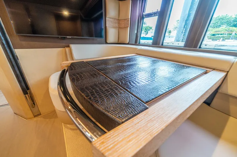 Costa Luna Yacht Photos Pics Luxurious interior of 2014 Azimut 64 yacht with elegant seating and table.